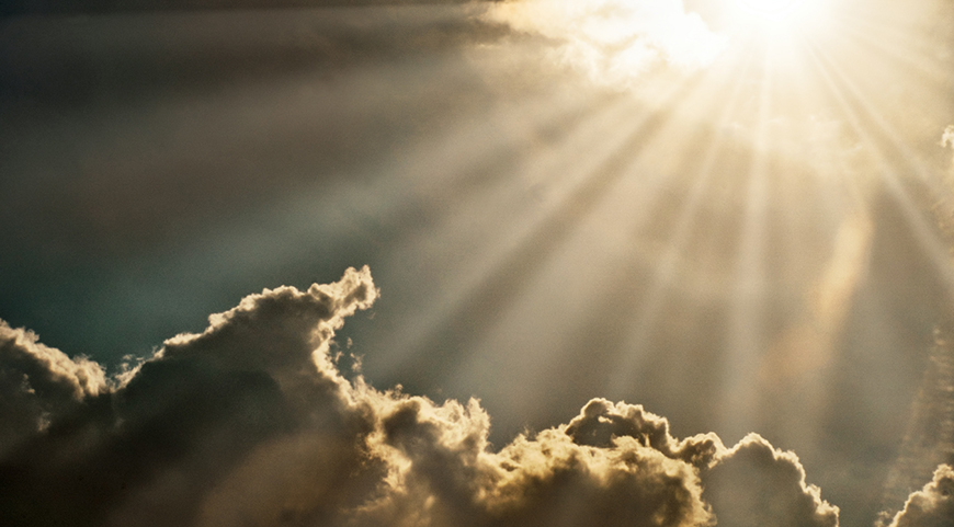 bright burst of sunlight over clouds