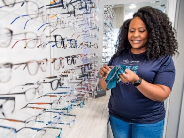 woman cleaning glasses