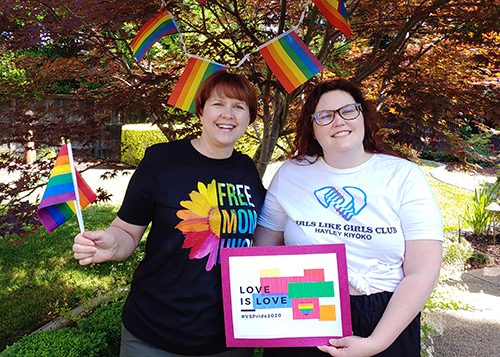 Outdoor flag garland by Rochelle, Communications Specialist, pictured with her daughter Maddie